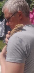 Ruby, our bearded dragon, getting a cuddle from Steve